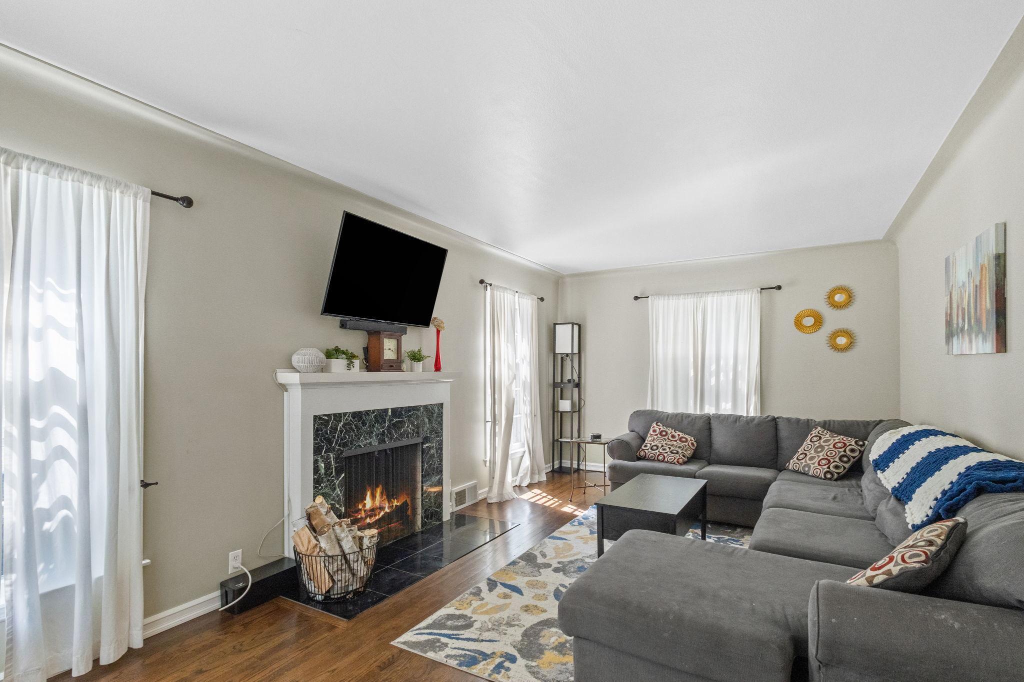 Offering a perfect blend of charm and modern amenities you'll love the spacious living area featuring a cozy wood-burning fireplace for those chilly Minnesota evenings.