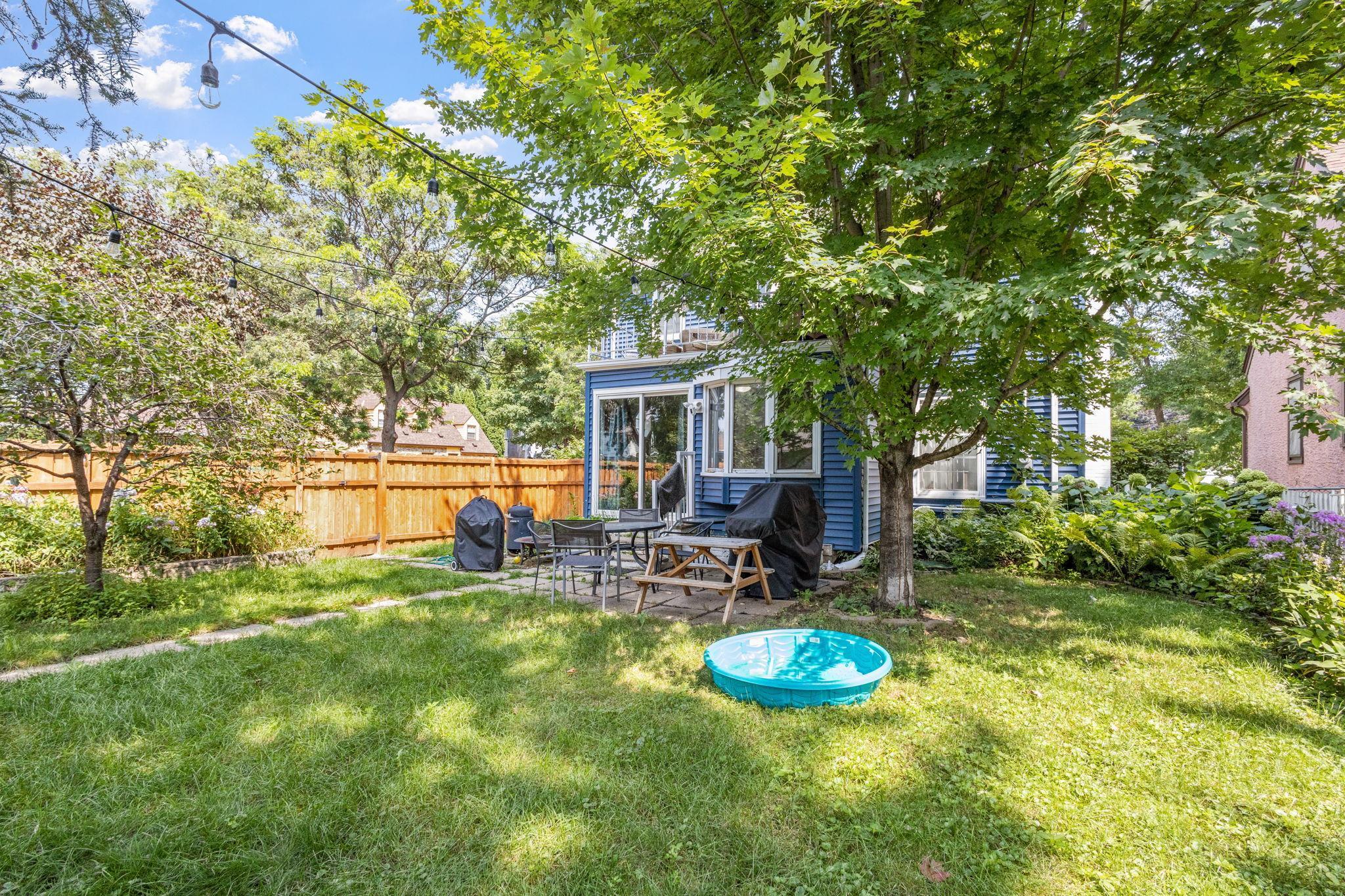 The exterior is equally impressive with a privacy fence and large gardens.