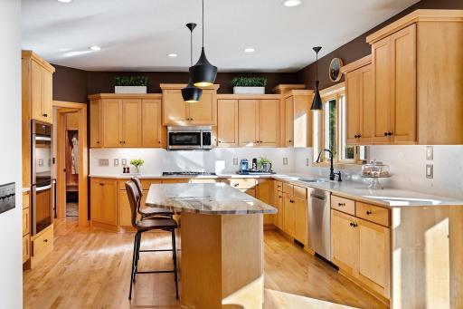 New appliances, lighting and counters in kitchen