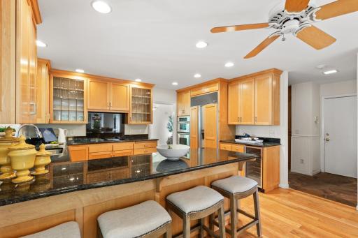 Kitchen features a built-in Refrigerator and Wine Fridge