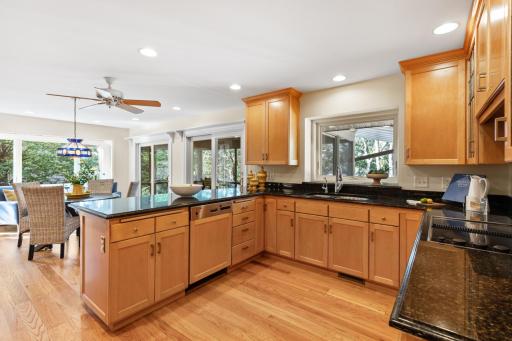 Updated Kitchen with Large Window Showcasing Views of the Lake