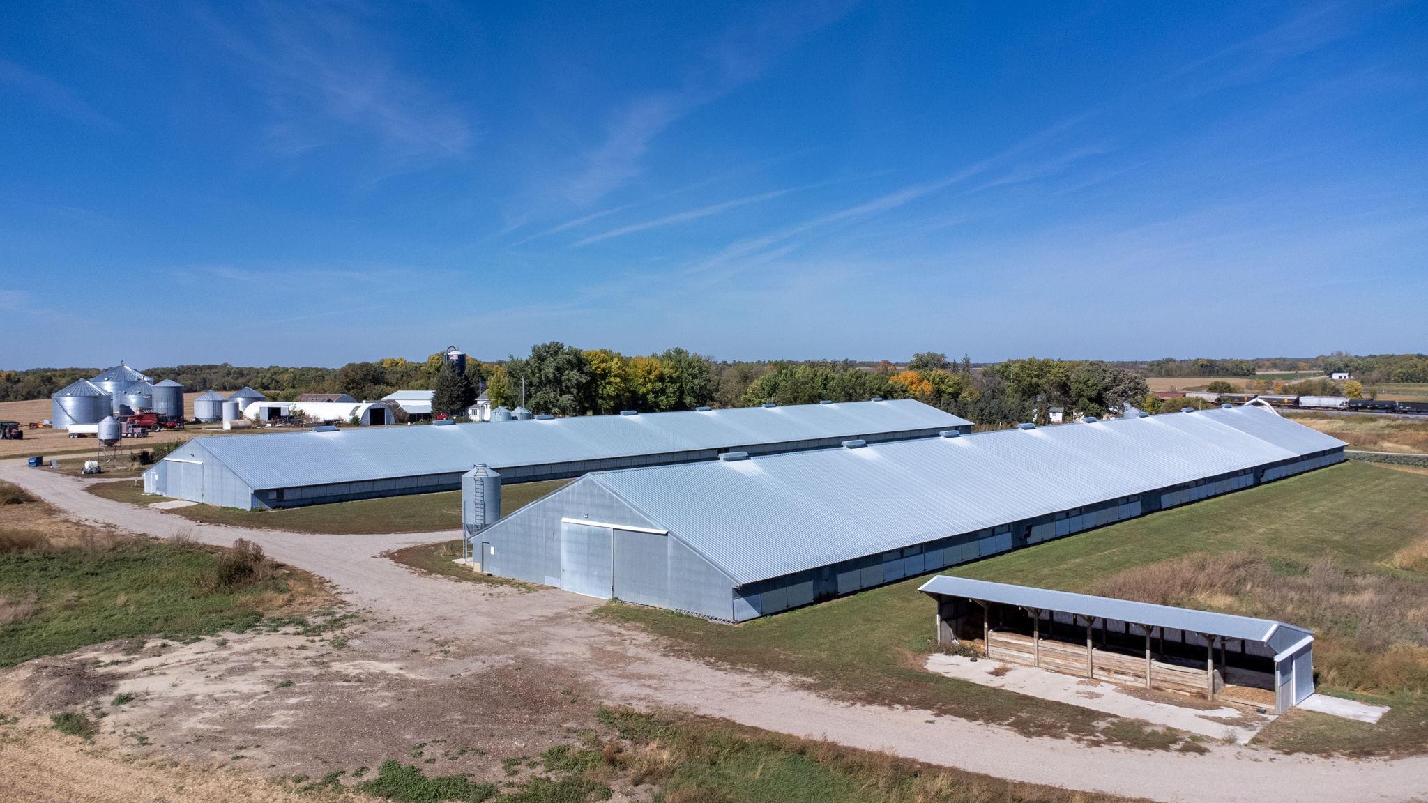 Two turkey barns measuring 76 x 416 with new roofs.
