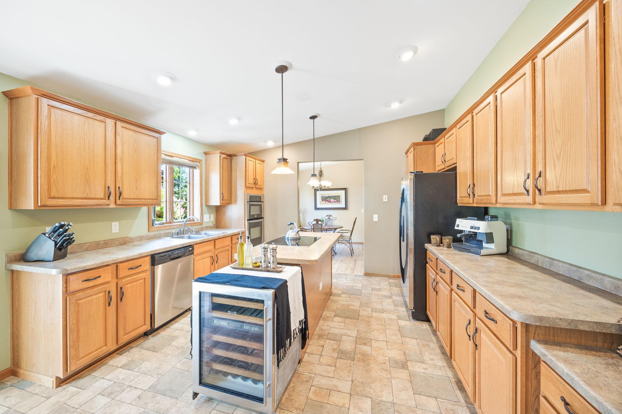 Kitchen with kitchen island. Formal dining room in the backround.