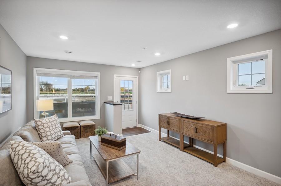 (Photo of decorated model, actual home's finishes vary) Feel at home in this spacious and open family room.