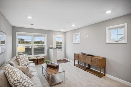 (Photo of decorated model, actual home's finishes vary) Feel at home in this spacious and open family room.