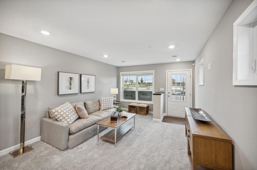 (Photo of decorated model, actual home's finishes vary) Notice the stunning natural light pouring into the family room.