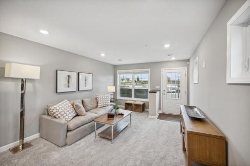 (Photo of decorated model, actual home's finishes vary) Notice the stunning natural light pouring into the family room.