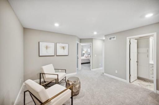 (Photo of decorated model, actual home's finishes vary) Relax, play and enjoy in the loft!