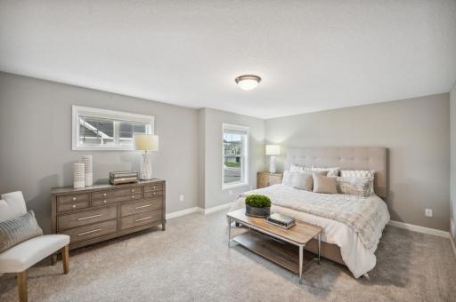 (Photo of decorated model, actual home's finishes vary) Find your retreat in this stunning owner's suite. Enjoy the exclusivity of a private bath and huge walk-in closet.