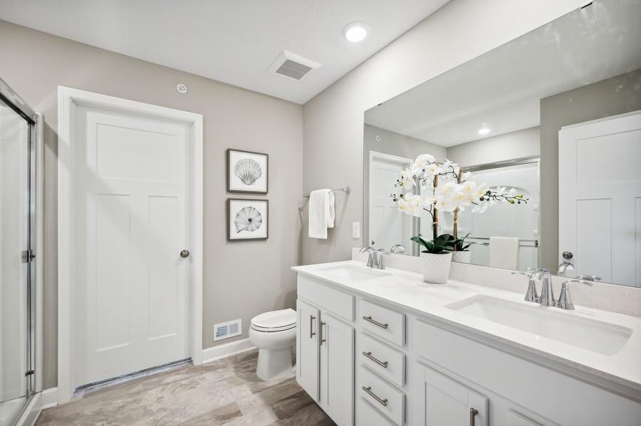 (Photo of decorated model, actual home's finishes vary) Another view of the spacious owner's bath.