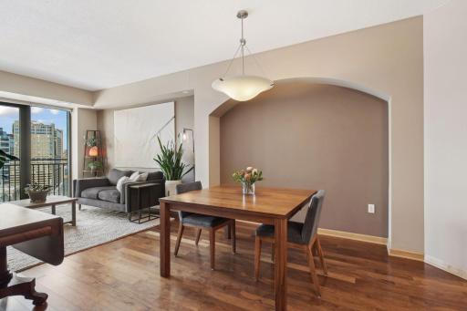 Large dining area with decorative arched wall niche.