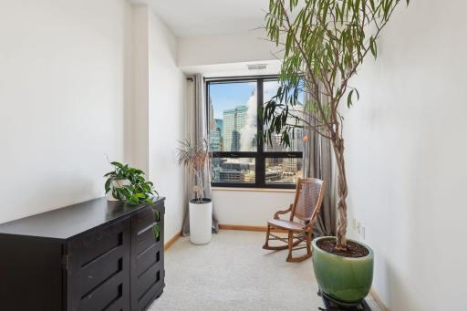 The den area is a perfect place for a home office, reading nook, or spot to enjoy your morning coffee. Great natural light and terrific views!