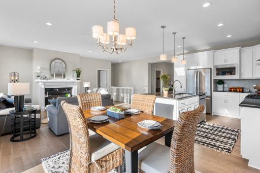 The eat-in kitchen seamlessly flows into the dining room, perfect for both everyday meals and entertaining.