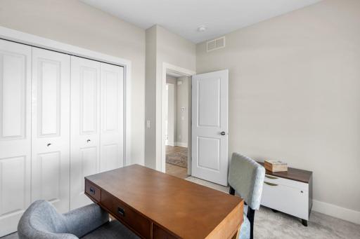 A second bedroom or home office is also located on the main floor, with a full bathroom
conveniently situated across the hall for guest convenience.