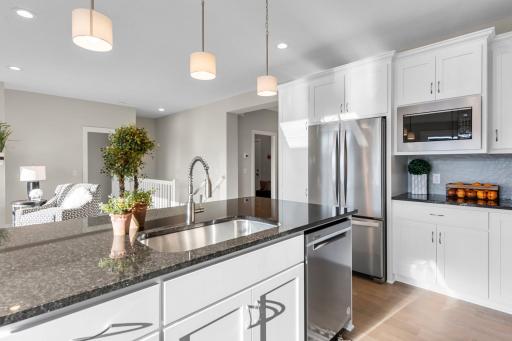 The brushed Nickle finishes and granite countertops throughout the home adds a touch of contemporary elegance to every room.