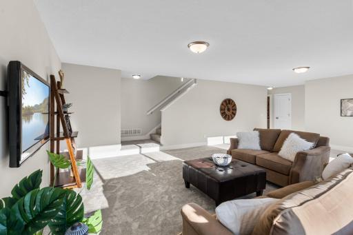 Descend to the lower level and immerse yourself in the ultimate entertainment zone with a
spacious family room perfect for hosting movie nights and gatherings.