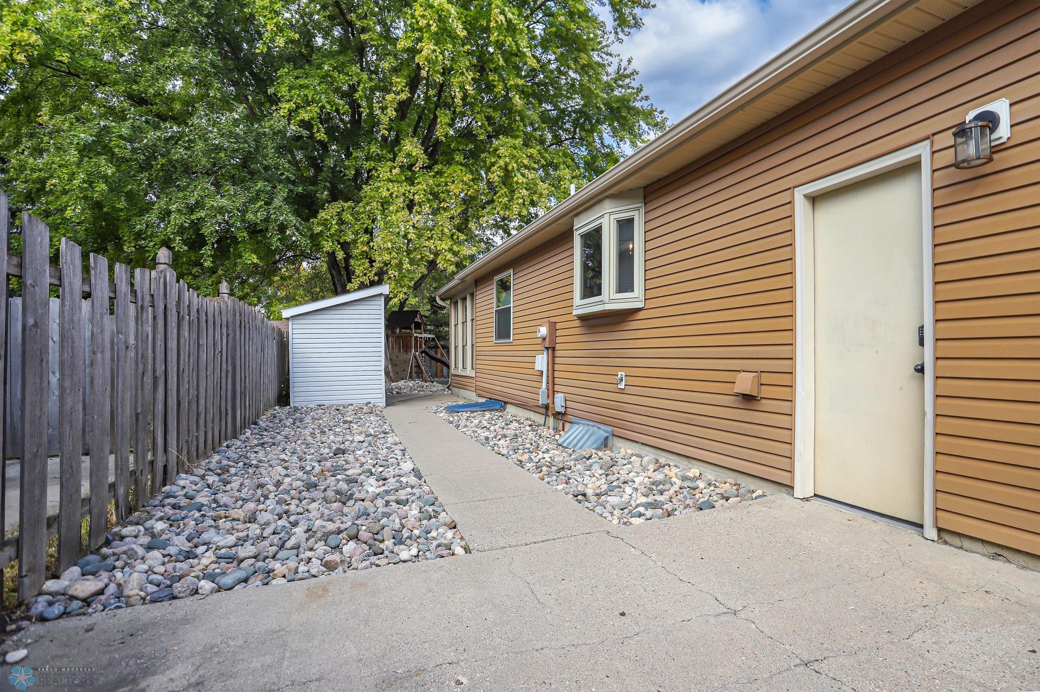 South side of Garage with storage shed