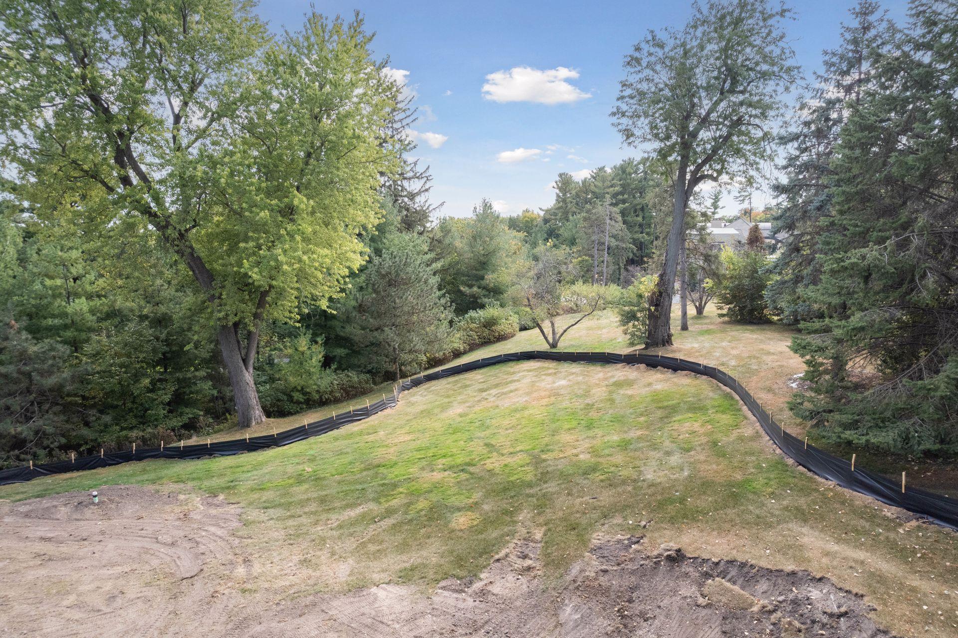 View from home site to yard area beyond silt fence - south facing