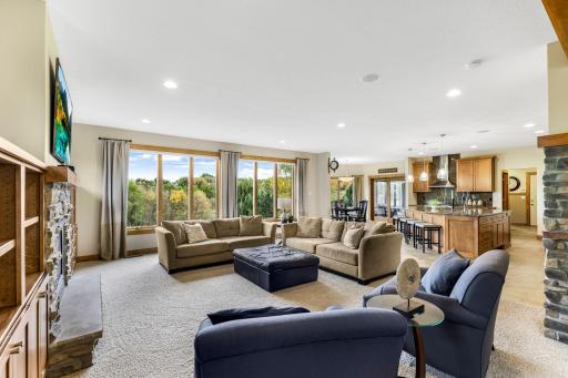 The Great Room features floor to ceiling windows that capture beautiful views of the property!