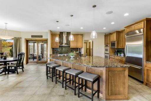 Maple cabinetry features flat panel doors, work station, roll-out storage and large "eat-in" center island