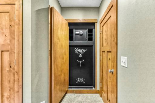 Fireproof, 40 gun safe carefully hidden behind the custom framed mirror