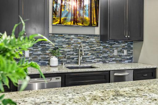 Appliances include dual KitchenAid beverage refrigerators, Fisher & Paykel dishwasher drawer, KitchenAid convection microwave and an ice maker!