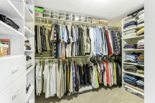 Generously sized 11 x 8 walk-in closet, includes a wall safe