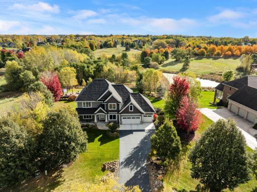 Discover the elegance and functionality in this walkout Two Story craftsman-style home in the exclusive Territory development.
