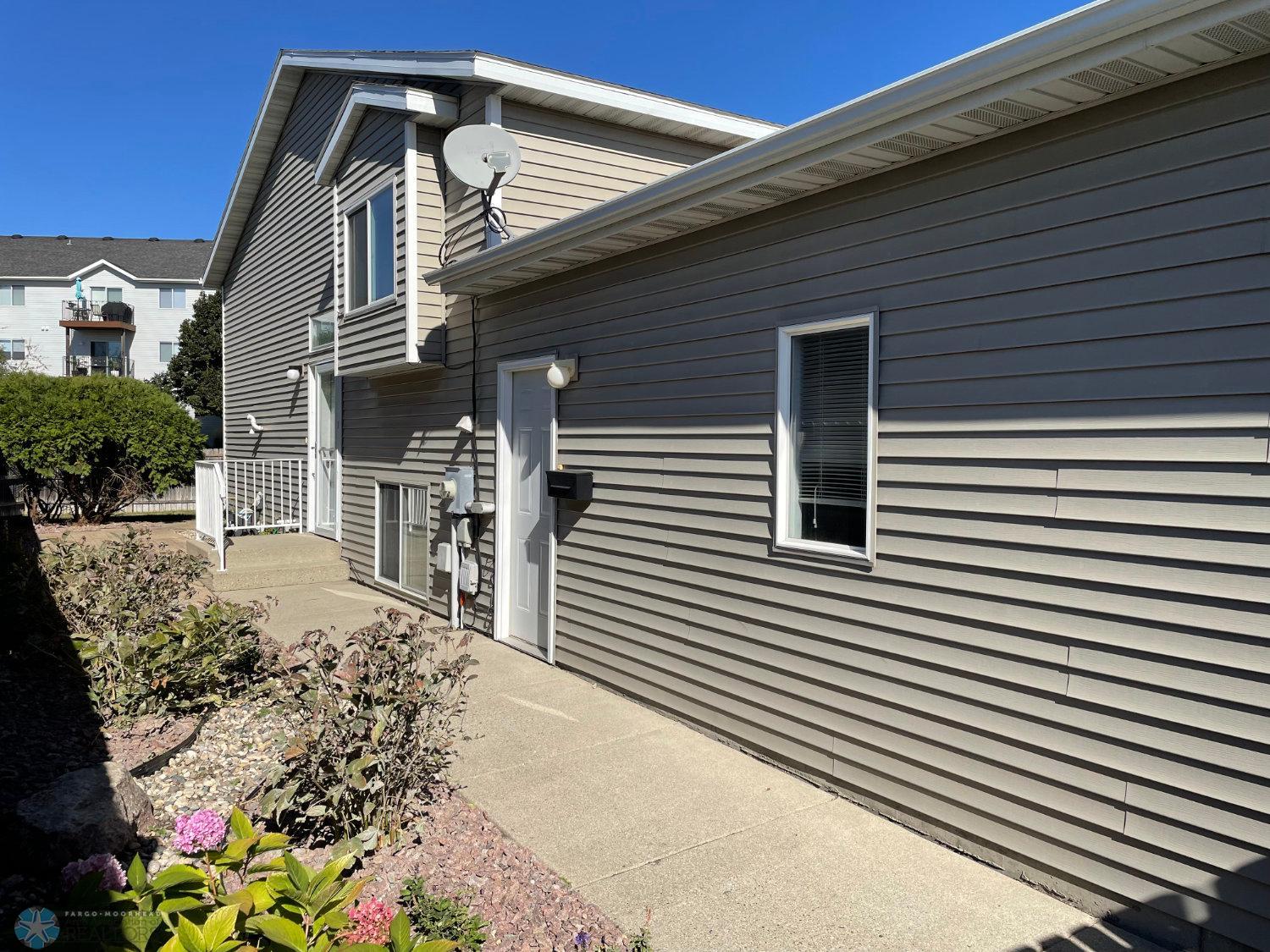 Exterior side of the home and landscaping.