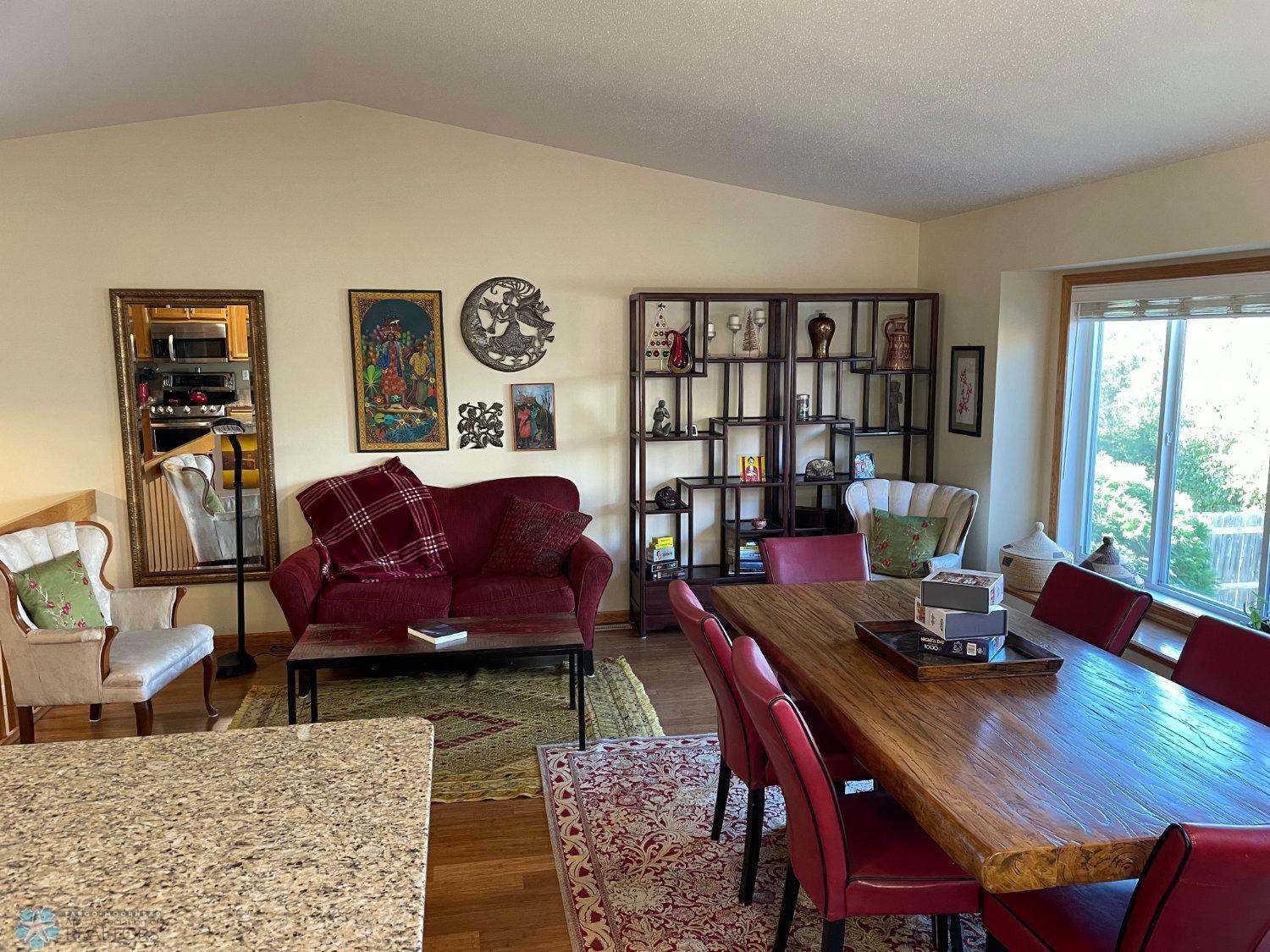 Vaulted living room and dining area viewed from kitchen island.jpg
