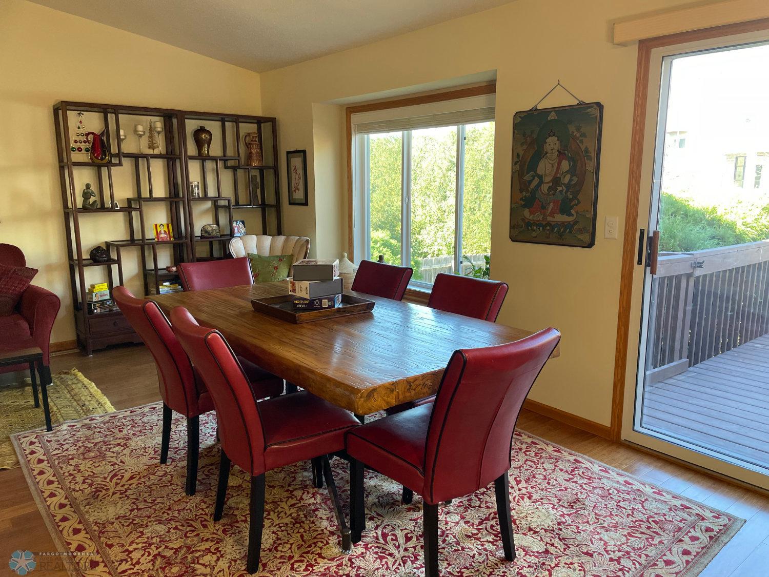 Vaulted living room and dining area.Solid bamboo hardwood floor.