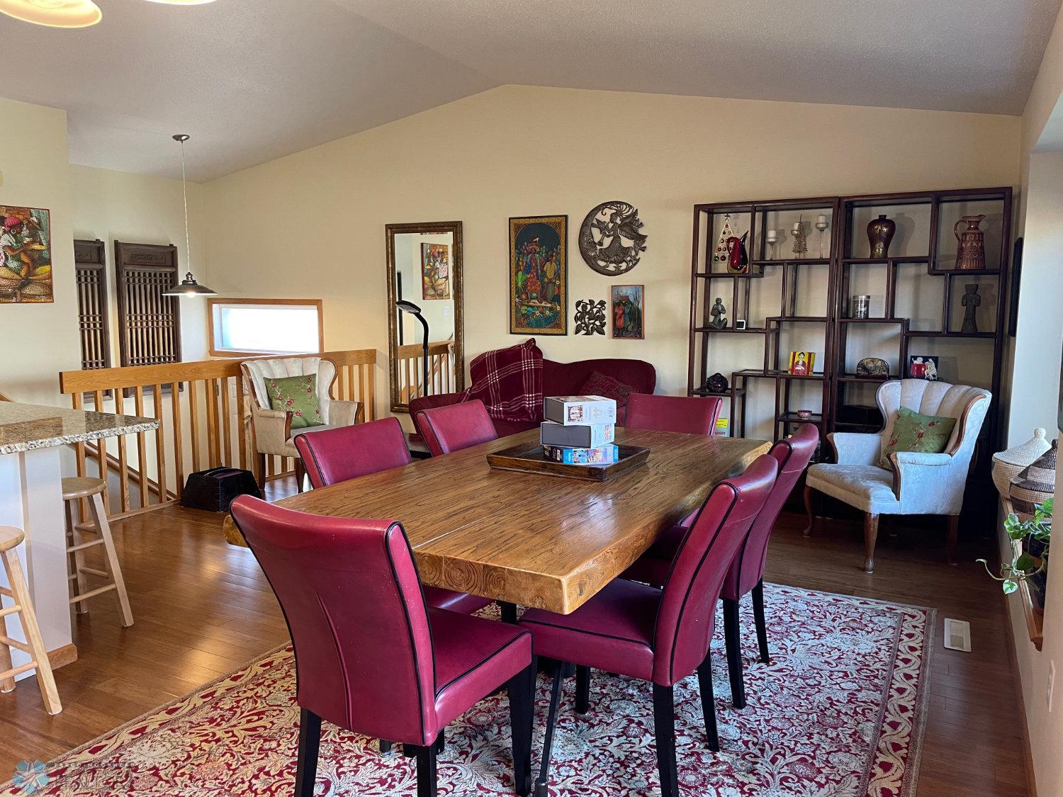 Vaulted living room and dining area viewed from patio door.Solid bamboo hardwood floor.