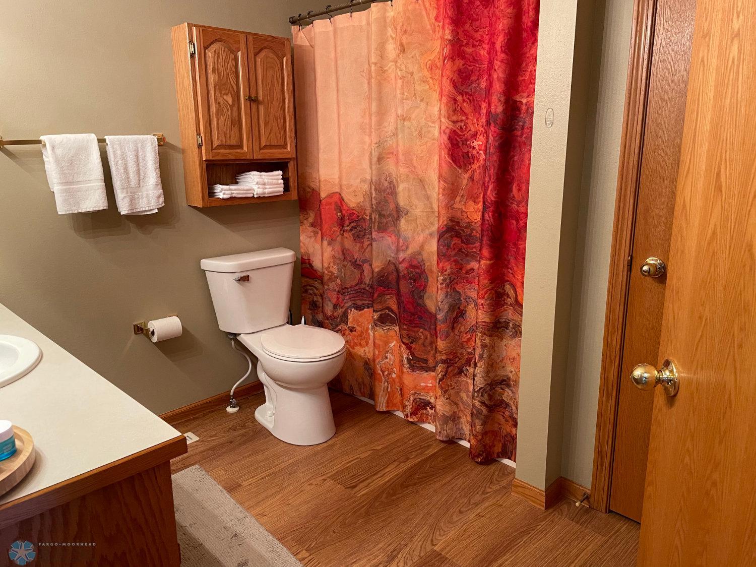 Full Hollywood bath on upper level. New vinyl plank floor, toilet and faucet 2024