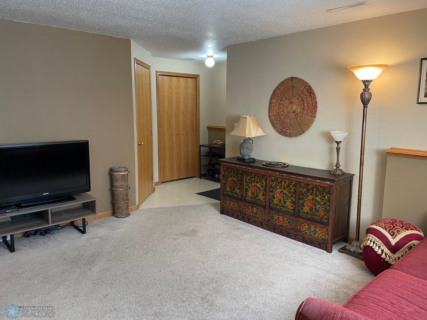 Family room view to laundry:furnace room and garage entryway.