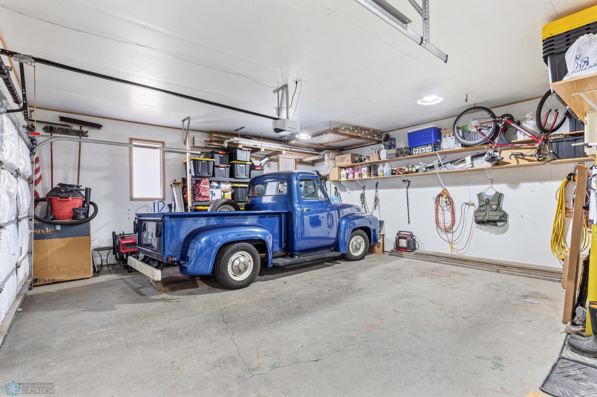 Heated/finished 3 stall garage, double bay pictured