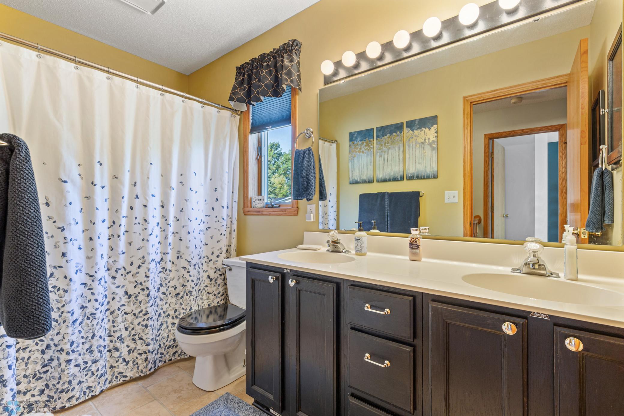 Upstairs full bath with double vanity
