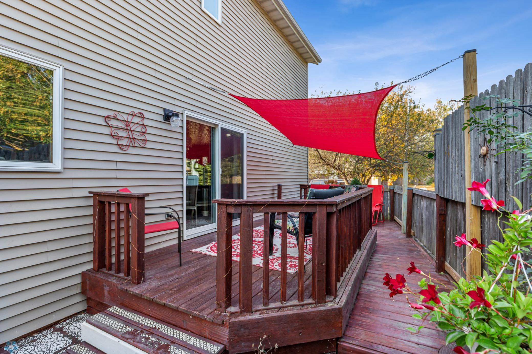 Deck and patio with brick fireplace, sunshade included