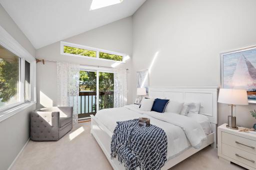Primary bedroom offers access to upper deck