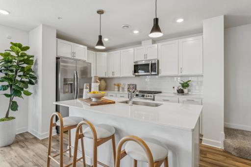 (Photo of a model home, actual homes finishes will vary) What a stunning kitchen with all brand new stainless steel appliance!