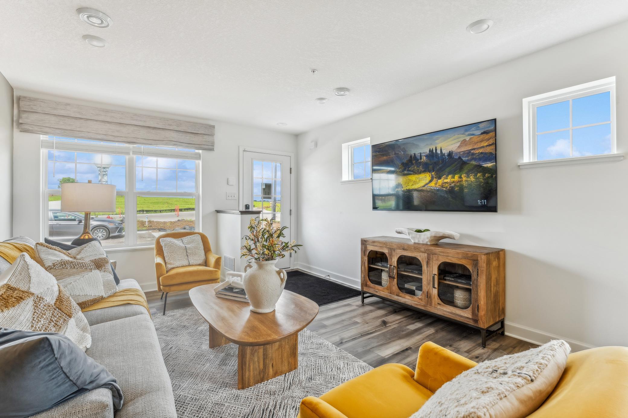 (Photo of a model home, actual homes finishes will vary) The spacious family gathering area seamlessly connects to the kitchen area, perfect for entertaining.