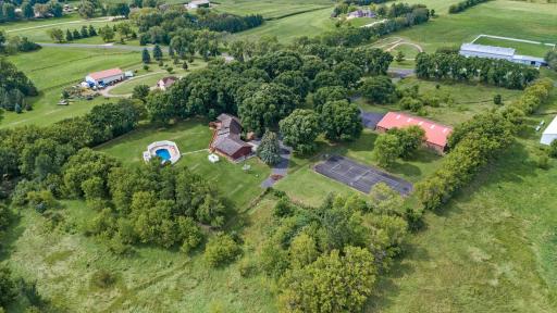 Nestled on a sprawling 13.5-acre lot, this stunning rambler home offers the perfect blend of country living with the convenience of being just minutes from the freeway, shopping, hospital, and schools.