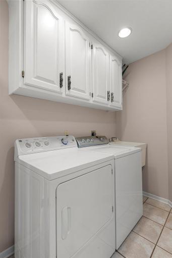 Complete with a laundry sink, half bath, and additional cabinet and counter space for all your storage needs.
