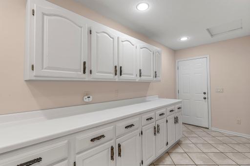 Just off the kitchen, the spacious mudroom serves as a practical entry from the garage.