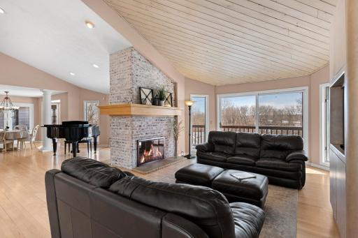As you step inside, youâll be greeted by soaring 18-foot vaulted ceilings and gleaming maple wood floors that extend throughout the main floor.