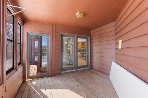 A screened-in patio off the dining room offers a perfect spot to relax and enjoy the fresh air.