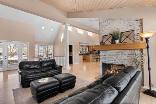 The great room features a double-sided fireplace, shared with the sitting room, creating a cozy atmosphere for both spaces.