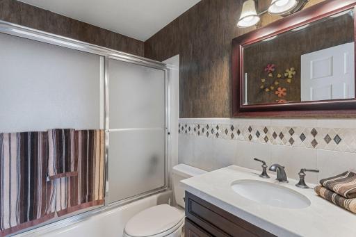 The main floor full bathroom ensuring convenience and comfort for family & guests.