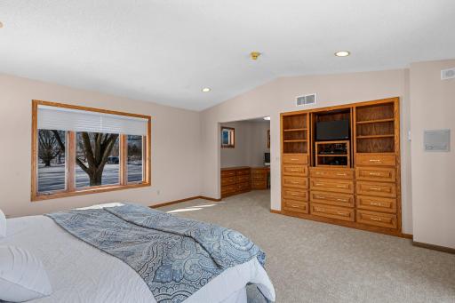 Featuring built-in drawers and a spacious desk area, providing both functionality and style.