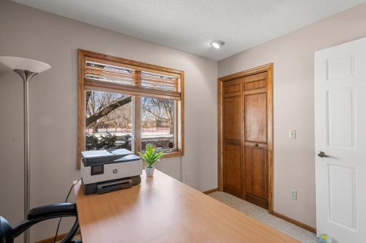 The two additional bedrooms on the main floor are bright and versatile.