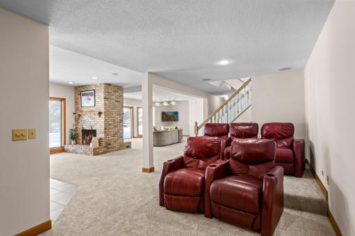 A dedicated theater room space and an exercise room provide additional entertainment and activities.